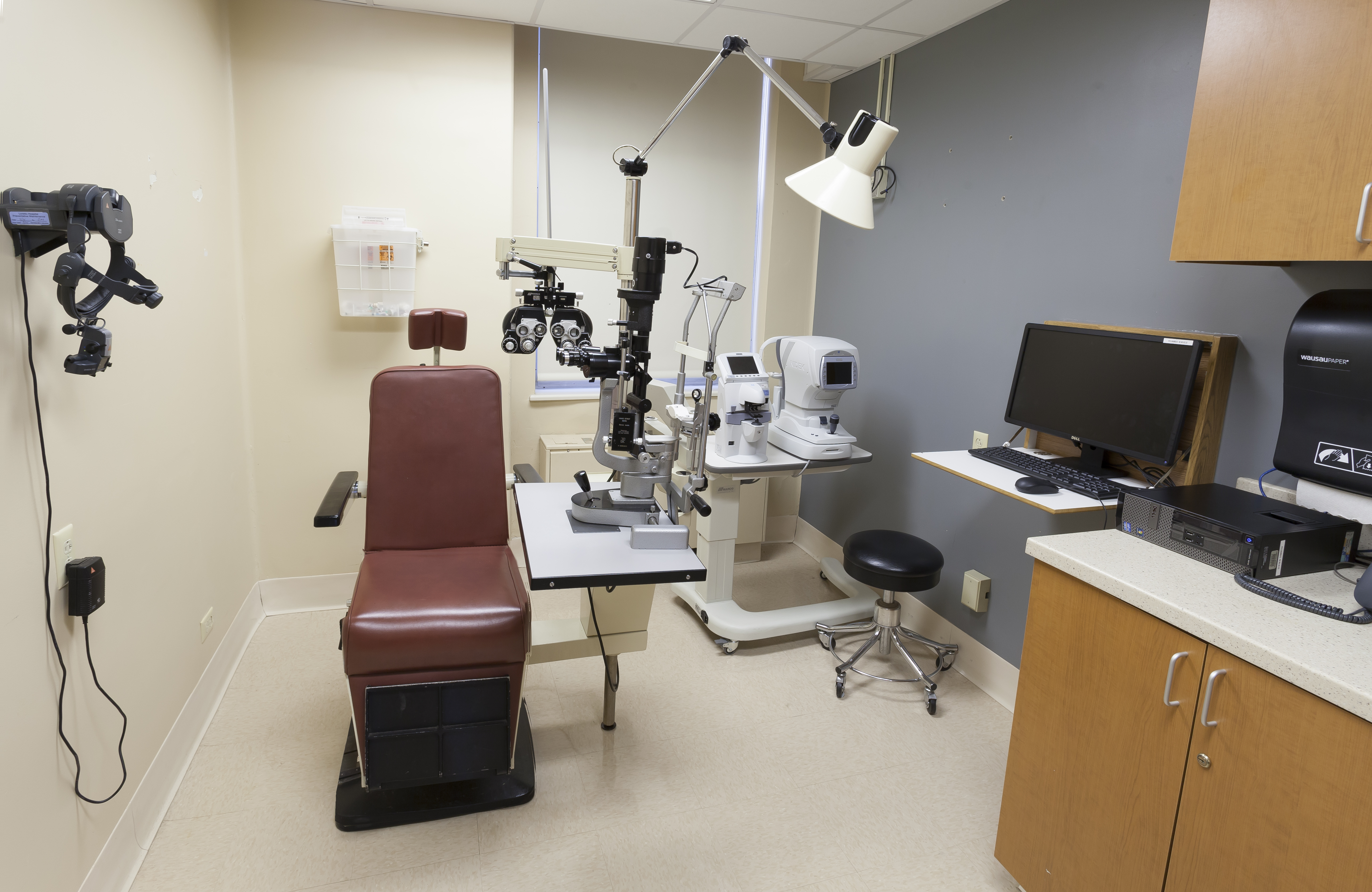 Eye doctor in his office